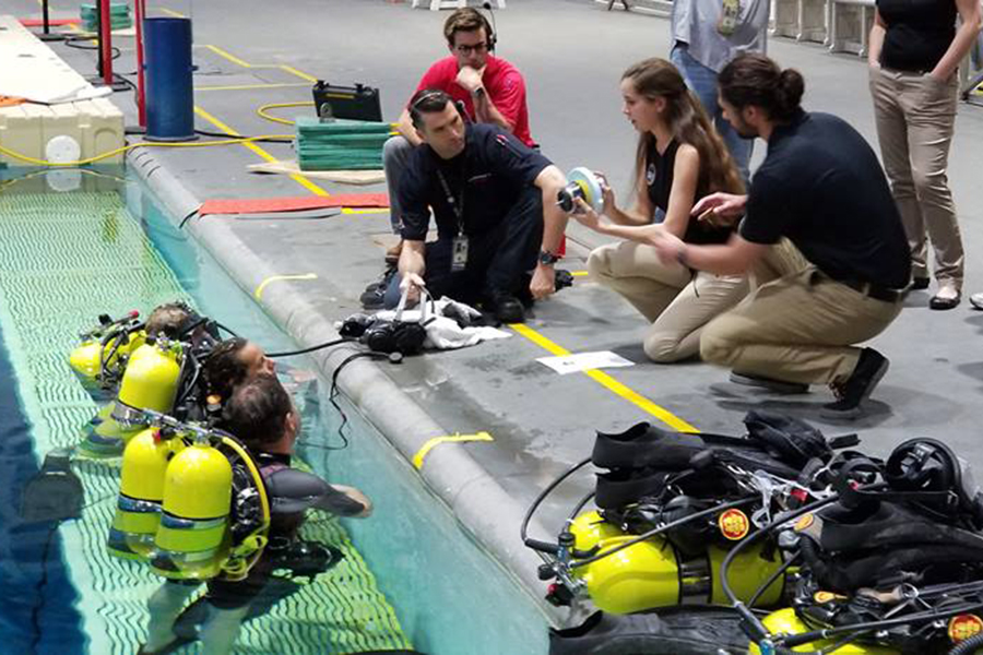 Purdue's NASA NExT team designed and tested a space station hole-repair tool in NASA's Neutral Buoyancy Lab.
