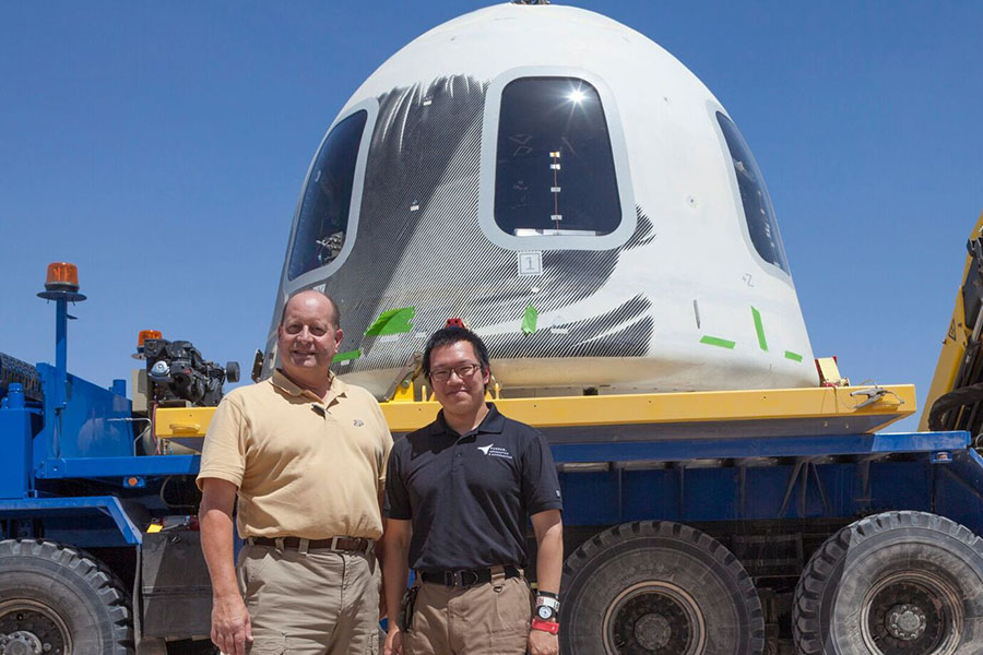 Steven Collicott, professor of aeronautics and astronautics at Purdue, and Shih-Pin 'Benny' Cheng, an undergraduate student in Collicott&rsquo;s Zero-Gravity Flight Experiment class, stand in front of the New Shepard crew capsule at the Blue Origin facility in Texas. (Photo/Blue Origin)