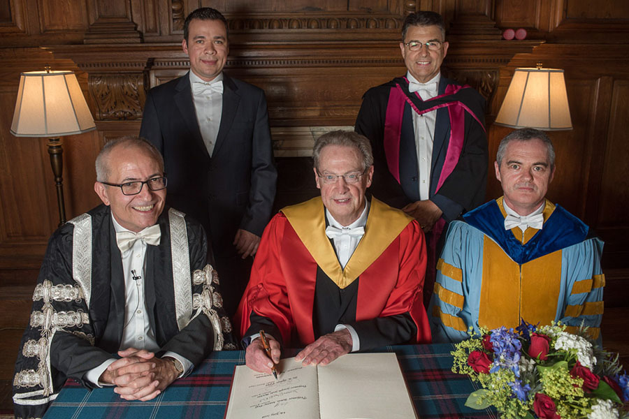 After the ceremony awarding AAE Professor R. Byron Pipes, John L. Bray Distinguished Professor of Engineering, an honorary degree at the University of Edinburgh, Pipes (middle front) was joined by Edinburgh's Acting Vice Chancellor Charlie Jeffery (left front),&nbsp;head of Edinburgh's School of Engineering and Professor Conch&uacute;r M. &Oacute; Br&aacute;daigh (right front), current Purdue doctoral student Eduardo Barocio (left rear)&nbsp;and another member of the University Court (right rear). All are shown wearing the white bow tie, an Edinburgh tradition for male graduation participants.