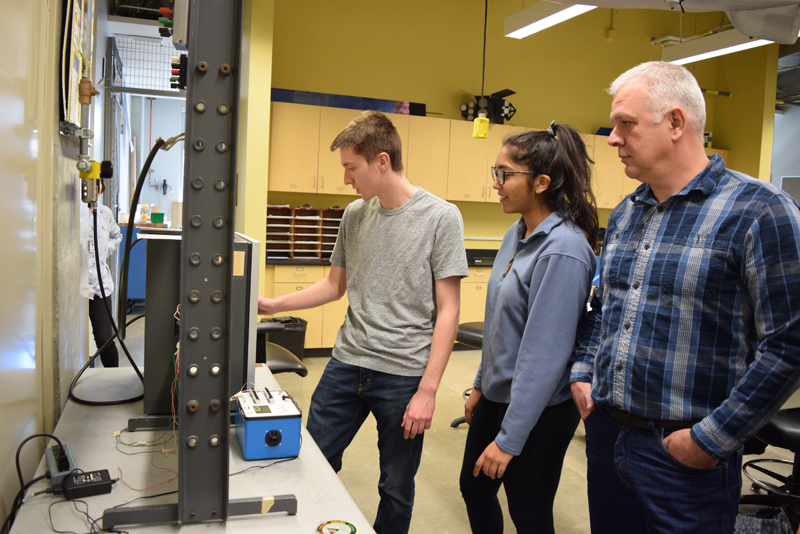 AAE Professor Alberto Mello and his students in the lab