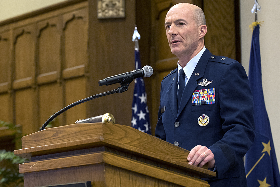 Azanno speaking at the podium