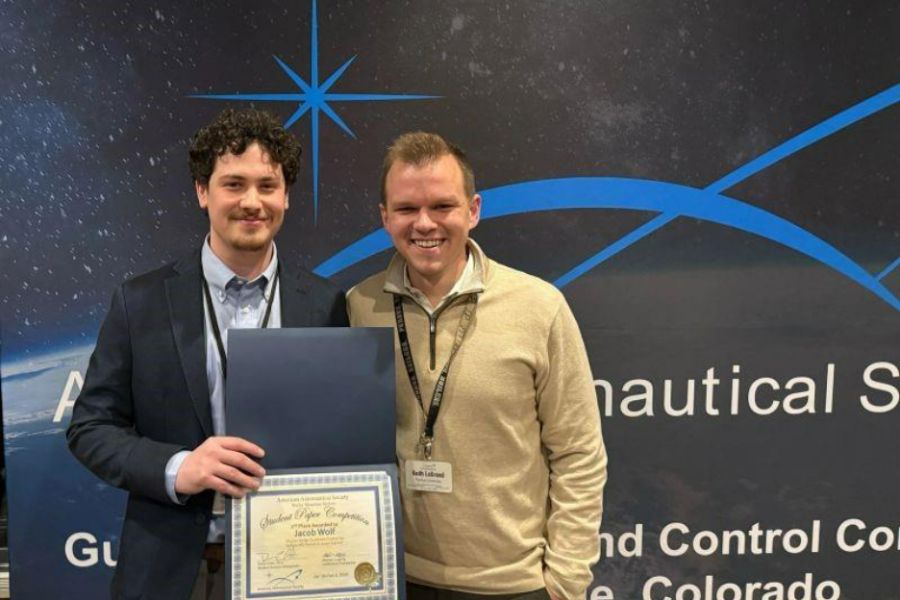 Jacob and Keith standing for an award