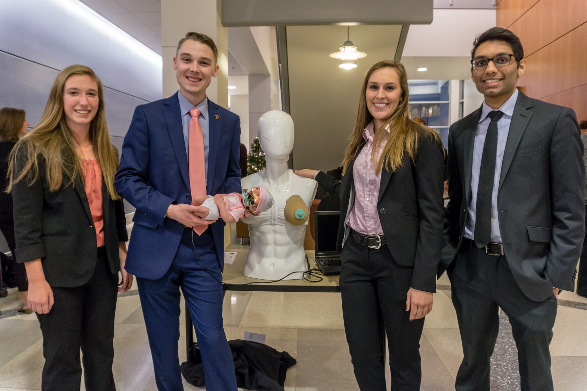A senior design team comprising Alexandria Sacopulos, Daniel Romary, Jennifer Ray, and Neal Patel developed "Martina," a breastfeeding simulation system.