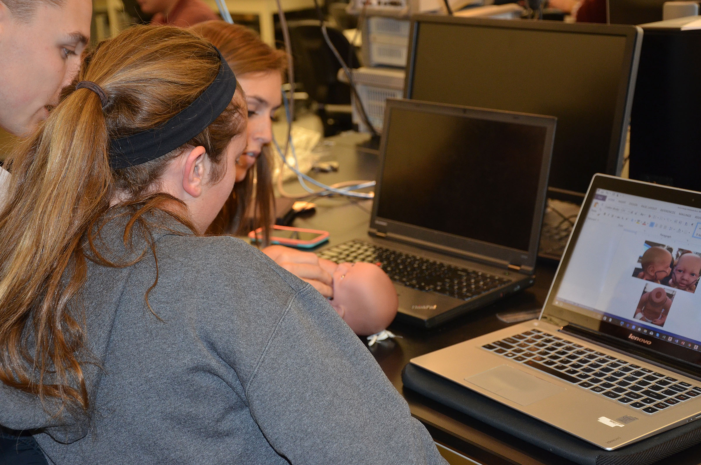 Students taking a look at the prototype
