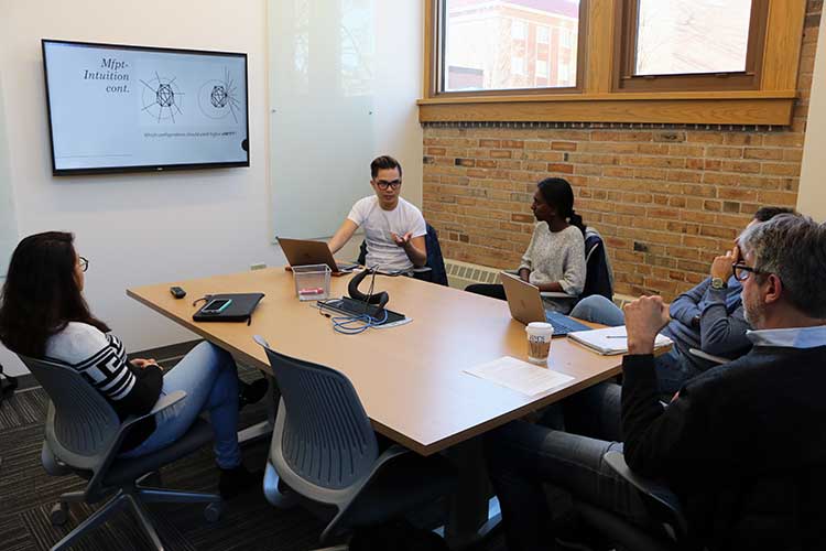 Photo of student presentation & Dr. Sporns