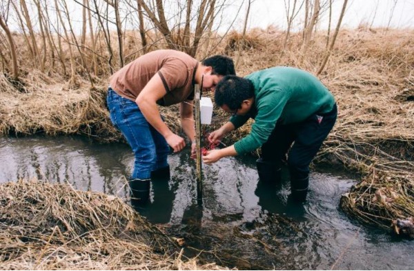 students setting up a soil sensor