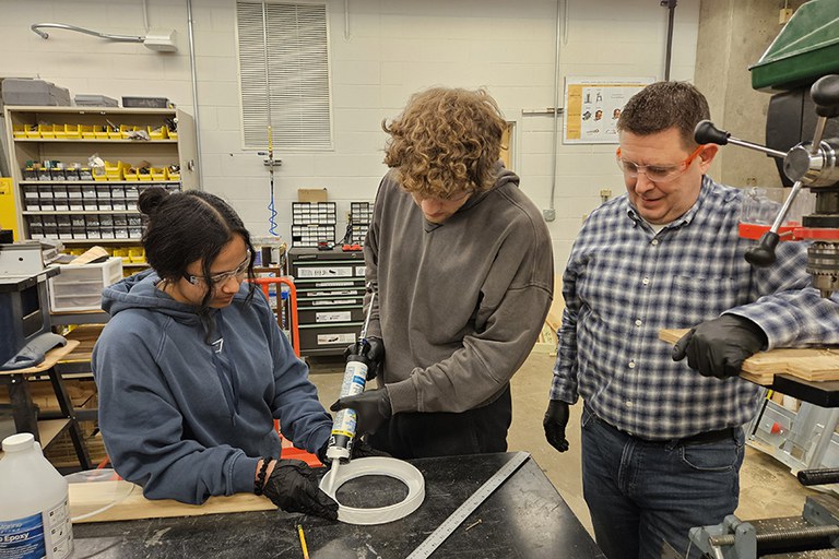 Two students being supervised 
