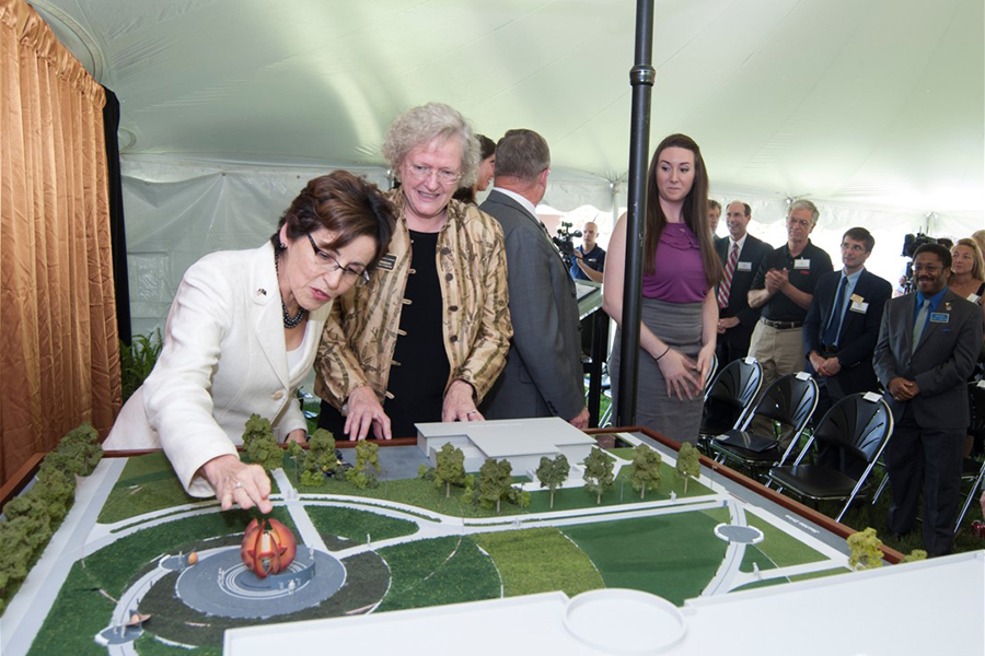 Mini VOSS model project on display table at press conference