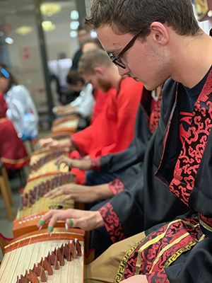 Students working on a Guzheng