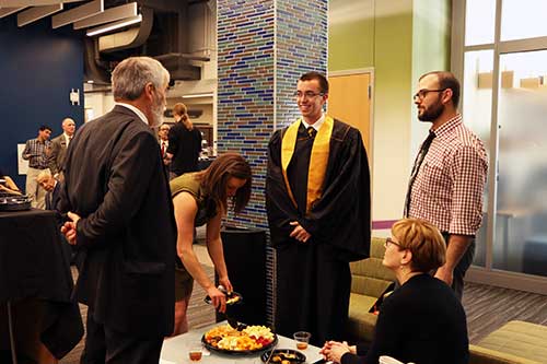 Pat Doc B Brunese (r) chats with Kyle Plummer & family