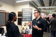 Photo of IE Career Fair - IU Health rep with student