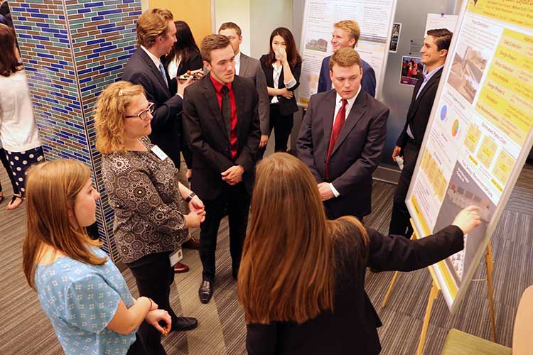 Photo of Team Endress & Hauser explaining poster