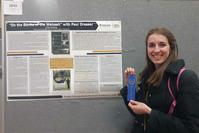Photo of Lily Bishop & winning poster</em>