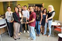 Photo of Hua Cai & IE grad students