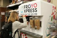 Photo of student dispensing frozen yogurt