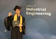 Photo of Aslanbek Xembayev at IE graduation reception