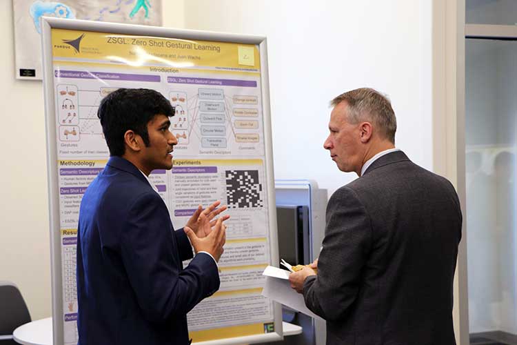 Photo of Mike Heard and grad student