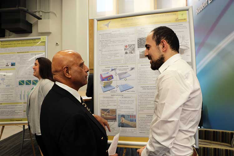 Photo of Ravi Talwar with grad student