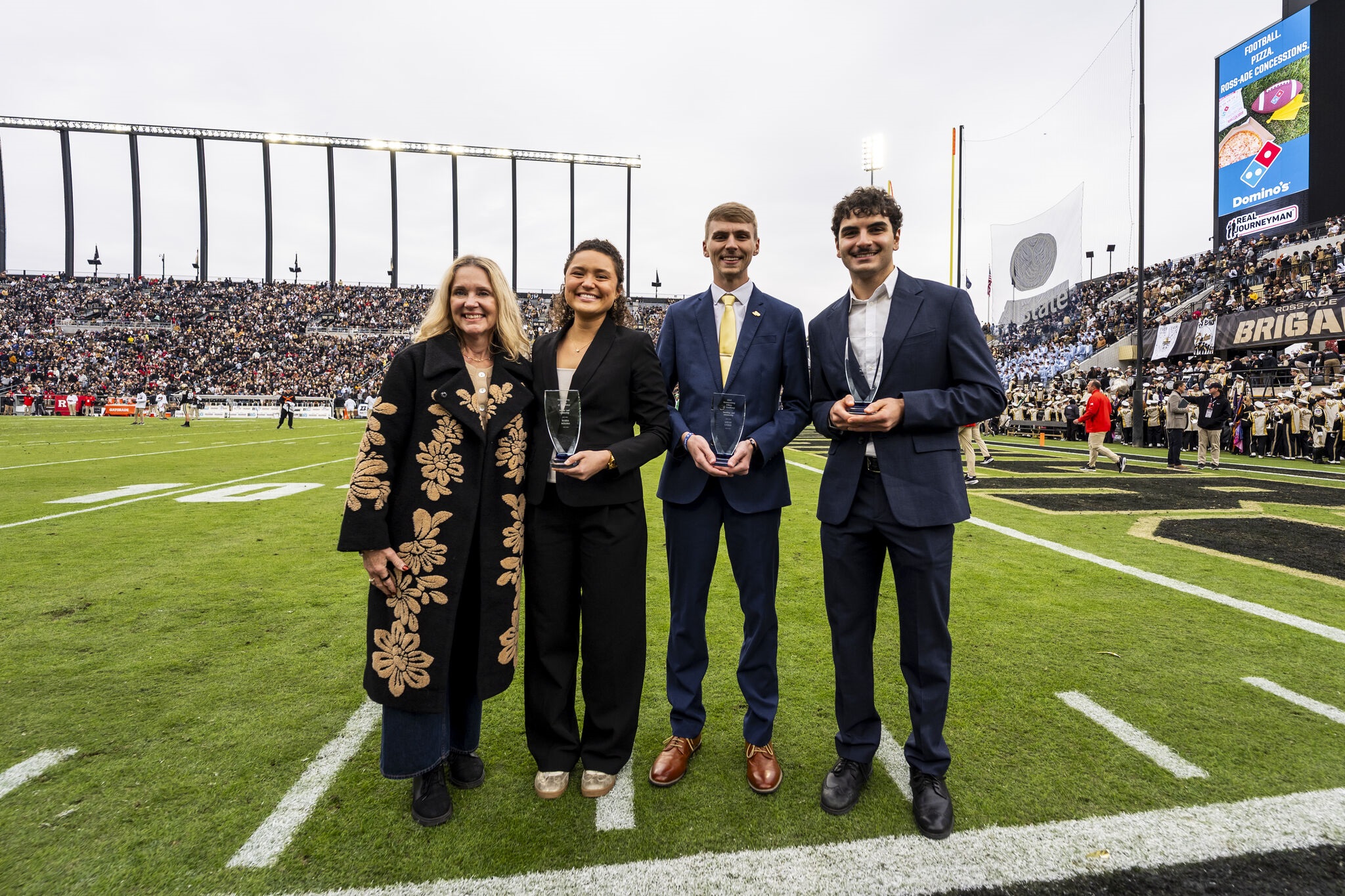 George Youssef (Far Right) receiving award at a Purdue Football home game.