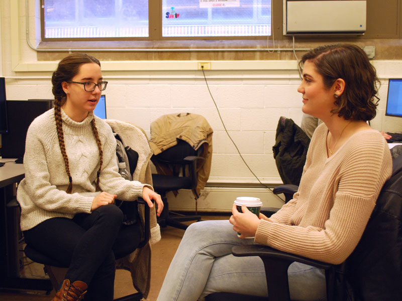 Natalie using a microscope