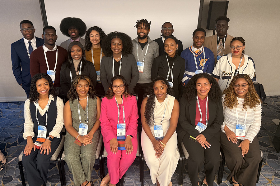 Group of students, some sitting, some standing, as part of NSBE's 25 Under 25