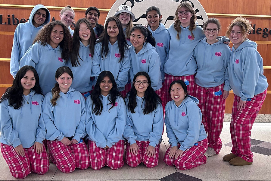 Students wearing matching pink plaid pajamas